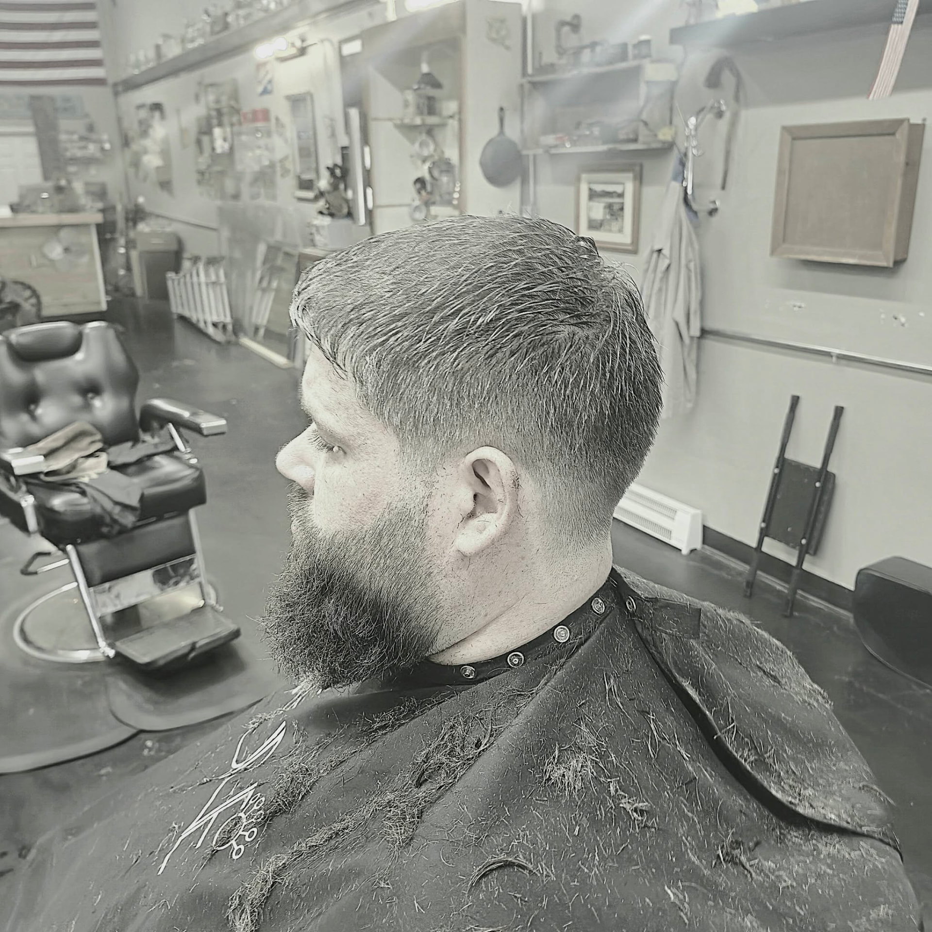Client after a fade haircut and shaped beard trim